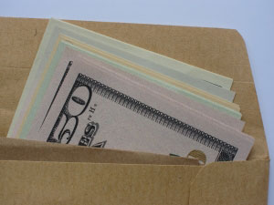 photo depicting cash in envelope shown at discovery to white collar criminal defense lawyers