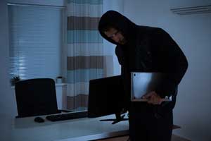 Photo of Thief Stealing Computers from Office
