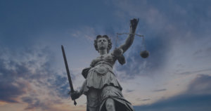 Lady Justice Statue with Twilight Sky in the Background